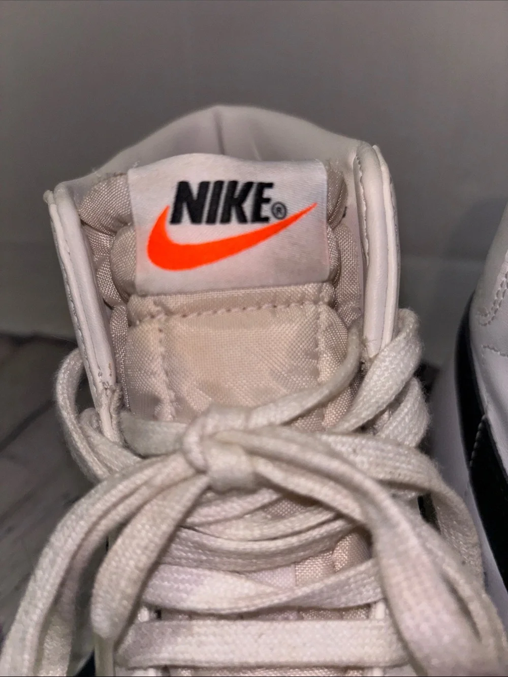 Nike White High-Top Sneakers with Black Stripe